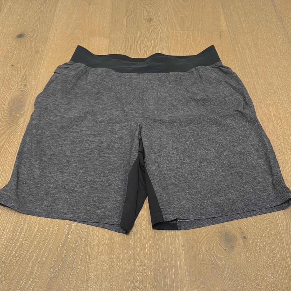 Lululemon two toned gray short in size large zipper pockets